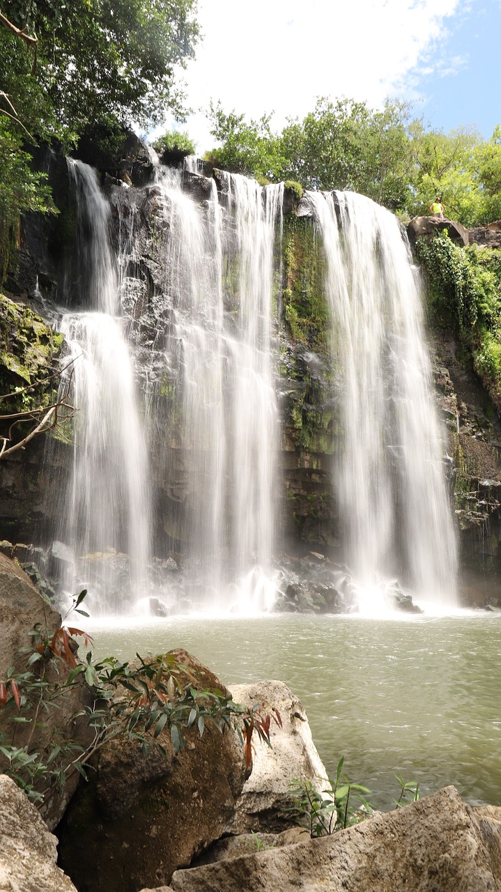 Tropical waterfall surrounded by lush nature
